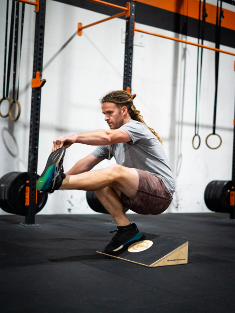 Slant board for weight lifting and CrossFit training